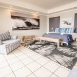 Luxury holiday rental living room in Pringle Bay featuring natural light and wide-angle interior photography.